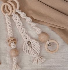 various wooden beads and rings on a white cloth