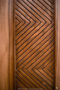 a close up of a wooden door with an intricate design on the front and side