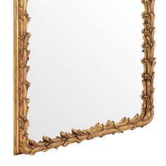 an ornate gold framed mirror against a white background