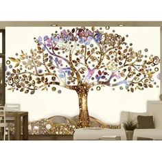 a living room with a large tree painted on the wall