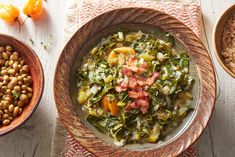 a bowl filled with vegetables and beans next to another bowl full of lentulas