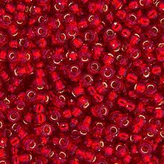 red glass beads are shown in close up