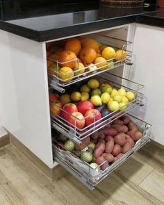 an open cabinet with fruits and vegetables in it