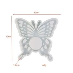 a white butterfly shaped object with measurements for it's wings and back side, sitting on