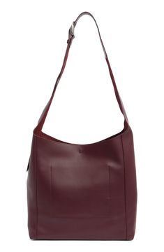 Gleaming hardware and rich leather distinguish a spacious shopper bag fitted with an adjustable strap for easy on-the-go styling. Bridge-clip closure Adjustable crossbody strap Interior wall pocket Protective metal feet Lined Leather Imported Leather Hobo Bag With Snap Closure For Shopping, Burgundy Leather Shoulder Bag With Metal Hardware, Rectangular Hobo Bag With Metal Hardware For Shopping, Rectangular Hobo Bag For Shopping With Metal Hardware, Shopping Hobo Bag With Metal Hardware, Everyday Use Burgundy Shoulder Bag With Metal Hardware, Burgundy Shoulder Bag With Metal Hardware For Everyday Use, Modern Hobo Tote Bag With Snap Closure, Modern Burgundy Bags For Work