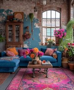 a living room filled with furniture and lots of flowers