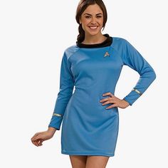 a woman in a star trek costume poses for the camera with her hands on her hips