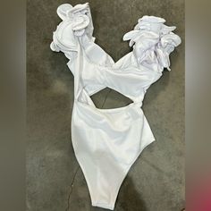 I Bought This For My Florida Bachelorette Trip And Never Got Around To Wearing It! White Ruffled One-piece Swimsuit, Beach Season Party Bodysuit With Ruffles, White One Piece For Beach Party, White One Pieces For Beach Party, White Beachwear One-piece For Party, White Beach Party One Piece, White Party One Piece For Beach Season, White Beach Party One-piece, Chic One Piece For Beach Party