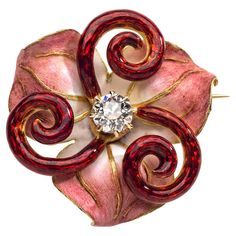 This beautiful jewel in the shape of a stylized lily is a fine example of the Art Nouveau art of enamelling. The flower stems are executed in translucent guilloché enamel. The flower petals are painted with opaque enamel in subtle shades of pink, rose and white. The veins of the flower leaves are highlighted in gold. The centre of the flower is set with a diamond. On the reverse the jewel is decorated with flower leaves, an understated sign of great quality. The brooch is signed on the pin CHIDO Art Nouveau Pendant, Spider Art, Art Nouveau Art, Flower Stems, Flower Leaves, Nouveau Art, Art Nouveau Jewelry, Rose Jewelry, Enamel Flower