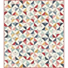 a quilt with many different colored triangles on the front and back, all in various colors