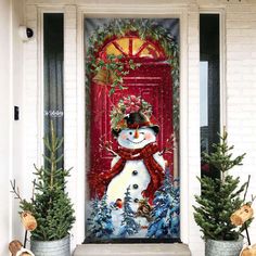 a decorated front door with two potted plants and a snowman