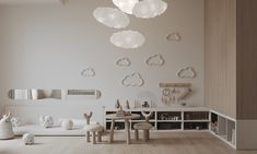 a child's playroom with white furniture and clouds on the wall above it