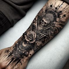 a man's arm with a black and white tattoo design on the left forearm