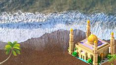 an aerial view of a building on the beach with palm trees and waves in the background