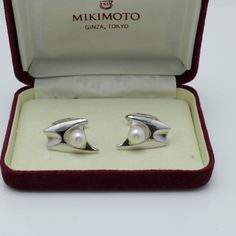 Vintage Mikimoto Pearl Cufflinks  Silver  Signed with an S and M They are 22.4mm by 14.8mm with three 7.3mm pearls each  Comes with The Box item Number 5573 Classic Pearl Earrings With Polished Finish For Formal, Classic Pearl Earrings With Polished Finish For Formal Occasions, Modern White Gold Pearl Earrings Gift, Modern White Gold Pearl Earrings For Gift, Modern White Cufflinks For Gift, Modern White Cufflinks As Gift, Modern Silver Pearl Earrings For Formal Occasions, Antique Cufflinks, Pearl Cufflinks