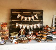 a table topped with lots of food and desserts