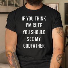 Buy If You Think I’m Cute You Should See My Godfather Dad Shirt at Fantasywears. Hight quality products with perfect design is available in a spectrum of colors and sizes, and many different types of shirts! Unisex T-Shirt – 100% Cotton (fiber content may vary for different colors) – Medium fabric (5.3 oz/yd² (180 g/m²)) – Classic fit – Tear away the label – Runs true to size Women T-Shirt – 100% combed ringspun cotton (fiber content may vary for different colors) – Light fabric (4.3 oz/yd Godfather Shirt Ideas, The Godfather Memes, The Godfather, Dad To Be Shirts, Types Of Shirts, Light Fabric, Light Colors, Thinking Of You, Slim Fit