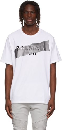 Cotton jersey T-shirt. · Rib knit crewneck · Logo graphic bonded at front Supplier color: White/Black/Silver | Balmain White Cotton T-Shirt Balmain Clothing, Knit Crewneck, Sweatshirt Designs, Logo Graphic, Jersey T Shirt, Luxury Streetwear, Cotton T Shirt, White Cotton, White Undershirt