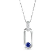 A dainty delight, this bright necklace is certain to add interest. Sterling silver A single round-cut blue lab-created sapphire is tucked into the base of the elongated oval pendant Two rows of petite round white lab-created sapphires decorate the bail 18-inch rope chain with spring ring clasp Elegant Blue Jewelry With Cable Chain, Elegant Blue Cable Chain Jewelry, Blue Sterling Silver Cable Chain Jewelry, Modern Blue Oval Necklace, Dainty Delight, Bright Necklace, Elongated Oval, White Lab, Oval Pendant