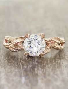 an engagement ring with leaves on it