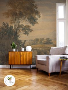 a living room with a painting on the wall