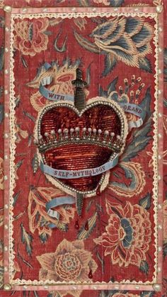 an ornately decorated book with a crown on it's cover and ribbon around the edges