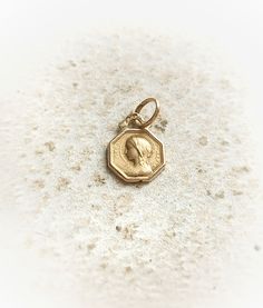 Beautiful Tiny French Antique 18k Solid Gold Religious Virgin Mary Octagon Medal, Gift for Woman  Size -  Medal itself - approx. 7,3x7,4mm / 0,28" x 0,29" Total length - approx. 12,7mm / 0,50" Weight -  0,31g Medal is in a great antique condition, made in solid 18k yellow gold (marked with eagle's head), very high quality and beautifully detailed yet so tiny little! Lovely unique piece! ✨  Would be great as a gift for antique loving woman 🧡 also perfect as a gift for any religious celebration, Elegant Yellow Gold Jewelry For First Communion, Gold Antique Pendant, Antique Pendant, Catholic Gifts, Baptism Gifts, French Antique, First Communion, Virgin Mary, French Antiques