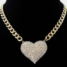 Clear Rhinestone Pave Heart Pendant Gold Necklace SetItem: Necklace & EarringsBrand: Jennifer & CompanyColor: Clear, Gold Length: 18" + 3" Long Pendant: 2" X 1.75"Earrings: 0.3" LongFastening: Lobster Clasp Metal: Alloy, Lead & Nickle FreeMaterials: Metal, Rhinestones Theme: Heart All Measurements are Approximate Sold As One Individual Necklace & 1 Pair of Matching Earrings Silver Necklace Set, Bling Necklace, Heart Pendant Gold, Dope Jewelry, Silver Heart Pendant, Gold Necklace Set, Stacked Jewelry, Long Pendant, Pendant Gold