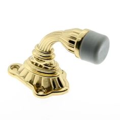 an antique brass door handle on a white background