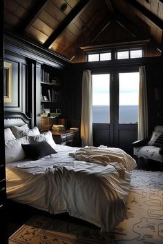 a large bed sitting in a bedroom next to a window