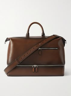 Berluti's bag has been expertly crafted in France from premium Venezia leather that will develop a unique patina over time. Designed with both top handles and a detachable shoulder strap, it's sized to hold everything you need for a weekend away and features a zipped compartment at the base to keep shoes separate from your clothes. Leather Satchel With Detachable Handle For Business Trips, Elegant Bridle Leather Travel Bag, Luxury Brown Bridle Leather Shoulder Bag, Luxury Bridle Leather Shoulder Bag For Daily Use, Luxury Bridle Leather Travel Satchel, Elegant Formal Bridle Leather Bag, Luxury Brown Bridle Leather Bag, Luxury Bridle Leather Travel Bags, Luxury Bridle Leather Rectangular Shoulder Bag