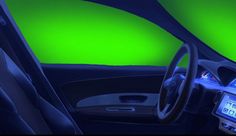 the interior of a car with green walls