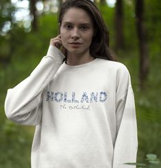 You'll love this Delft, South Holland, the Netherlands sweatshirt. The soft, comfy material is made from a blend of cotton and polyester. There are no itchy side seems and it has a trendy, loose fit. The Delft/folk art inspired crewneck is an iconic way to represent this famous city in the Netherlands - and makes a great gift for the traveler in your life.  Please use the sizing guide for additional guidance on sizing! This Sweatshirt is a Unisex-style, so it has a smaller fit than men's sizing, Cottagecore Sweater, South Holland, Digital Graphic Design, Graphic Design Elements, European Vacation, Art Populaire, Unisex Style, Delft, Unisex Fashion