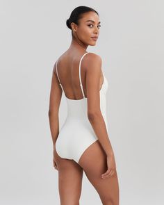 Chic and retro-inspired, The Veronica One-Piece is a luxe staple. This moderate coverage one-piece offers support with underwire cups and adjustable straps. Wear it to the beach or with your favorite pair of pants to double as a bodysuit. Underwire Bodysuit With Built-in Bra For Vacation, Modern Swimwear With Built-in Bra For Summer, Underwire Bodysuit With Built-in Bra For Sunbathing, Summer Sculpting Bodysuit With Built-in Bra, Chic Underwire Bodysuit For Poolside, Shapewear Bodysuit With Underwire For Poolside, Chic Underwire Bodysuit For The Beach, Chic Underwire Bodysuit For Swimming, Underwire Shapewear Bodysuit For Poolside