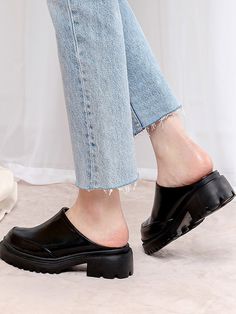 Editor's NotesSPUR's shoes are unique and timeless for everyday wear.- Platform Mules- Chunky lug sole- Modern trendy round front toe - Glossy leather texture- Feminine and minimal style- Easy slip-onMeasurements(in.)- Size: KR 230MM (US 6) ~ KR 250MM (US 8)- Heel Height: 2in.Composition & Care- Synthetic leather - Avoid direct heat and moisture- Professional cleaning is recommendedDesigner- by SPUR Casual Platform Loafers With High Heel, Black Chunky Platform Clogs With Round Toe, Trendy Clogs With Lug Sole And Round Toe, Casual Heels With Lug Sole And Round Toe, Spring Heels With Lug Sole And Round Toe, Synthetic Closed Toe Platform Loafers, Synthetic Round Toe Heels With Lug Sole, Synthetic Heels With Lug Sole And Round Toe, Casual High Heels With Lug Sole