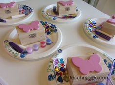 four plates with different designs on them sitting on a table