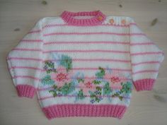 Handknitted babysweater, pink and white with flowers Handmade Pink Sweater For Spring, Cute Handmade White Sweater, Cute White Handmade Sweater, Cute Hand Knitted White Sweater, Cute White Hand Knitted Sweater, Cute Pink Crochet Sweater, Cute Hand Knitted Pink Sweater, Cute Pink Crochet Knitting Pattern, Crochet Baby Sweaters