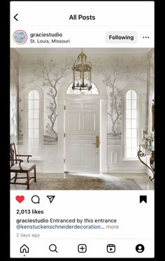 an ornate entry way with white walls and doors