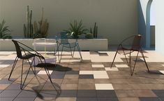 several chairs and tables on a tiled floor with cacti in the back ground