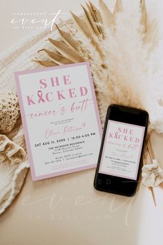 a cell phone sitting on top of a table next to a pink and white wedding card