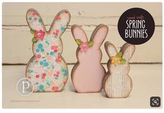 three wooden bunnies with flowers on them