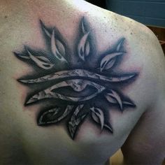 the back of a man's shoulder with an artistic tattoo design on his chest