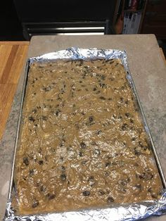 an uncooked cookie sheet covered in chocolate chips