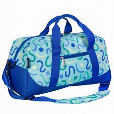 Make packing for sleepovers, sports practices, and weekends at grandma’s a breeze with Wildkin's Kids Overnighter Duffel Bag! The spacious interior means your child can pack the essentials and then some, while the exterior zippered compartment conveniently stores the most important items so that your child can access them in a flash. Each Overnighter Duffel Bag is made with a durable exterior fabric and a nylon-lined interior. The Overnighter Duffel Bag comes complete with two attached carrying Casual Blue Gym Bag For Outdoor Activities, Functional Blue Duffle Bag For School, Casual Blue Duffle Bag For Outdoor Activities, Blue Sporty School Bag, Casual Blue Duffle Bag For School, Sporty Blue School Bag, Functional Blue Gym Bag For Overnight Trips, Casual Blue Sports Duffle Bag, Playful Blue Travel Bag