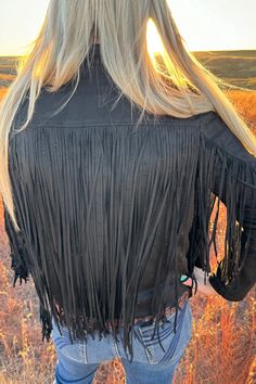 Shimmer and shine in this unique black faux suede jacket! Glimmering rhinestones and long fringe will have you shining bright with each step. Don't fret about a fashion emergency - this jacket is your to-go look for looks that are dynamite! True to size Shell : 92% polyester 8% spandex Lining: 100% polyester Size Fits XS 0 Small 2/4 Medium 6/8 Large 10/12 XL 14/16 2X 18/20 3X 22/24 Laid flat measurements below. Double chest size for circumference. SIZE CHEST LENGTH SLEEVE WIDTH SLEEVE LENGTH XS Black Velvet Jacket, Radiate Confidence, Vintage Jean Jacket, Western Graphic Tees, Peplum Blazer, Black Windbreaker, Shimmer And Shine, Long Fringe, Faux Suede Jacket