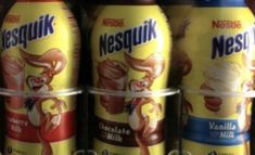 several cans of nestle are stacked on top of each other