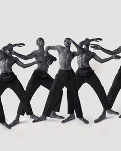 five black men are dancing together in the same pose with their hands on their hipss