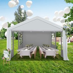 a white tent set up with tables and chairs for an outdoor wedding reception in the grass