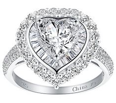 Show off your romantic side with the stunning glam style of this heart halo statement ring. It shines with sterling silver and cubic zirconia Diamonique simulated diamonds. Elegant Heart Ring With Halo Setting In Cubic Zirconia, Heart Cut Cubic Zirconia Halo Ring, Formal Heart Shaped Cubic Zirconia Diamond Ring, Cubic Zirconia Heart Ring With Halo Setting For Wedding, Formal Heart Ring With Center Stone In Cubic Zirconia, Elegant Diamond White Heart Ring With Halo Setting, Formal Diamond White Heart Ring With Halo Setting, Heart-shaped Diamond Ring With Halo Setting For Formal Occasions, Formal Heart-shaped Diamond Ring With Halo Setting