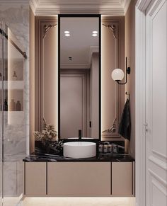 a bathroom with a large mirror and sink